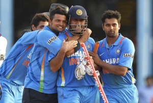 Suresh Raina, Bhuvaneshwar Kumar and R. Vinay Kumar celebrated with Dhoni after the match. (pic: Getty Images)